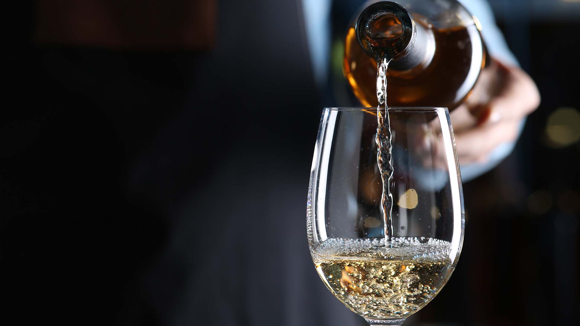 Wine being poured into a glass in the Sandeman Bar