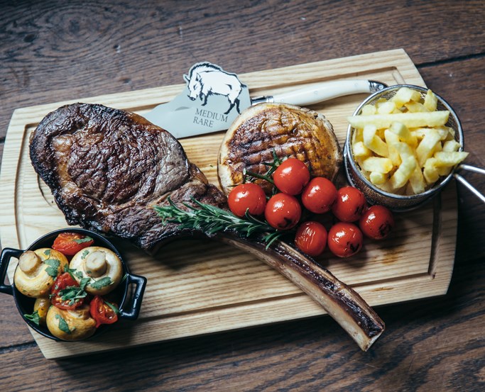 Tomahawk Steak, menu selection from The Grill & Smokehouse Restaurant at The Wild Boar