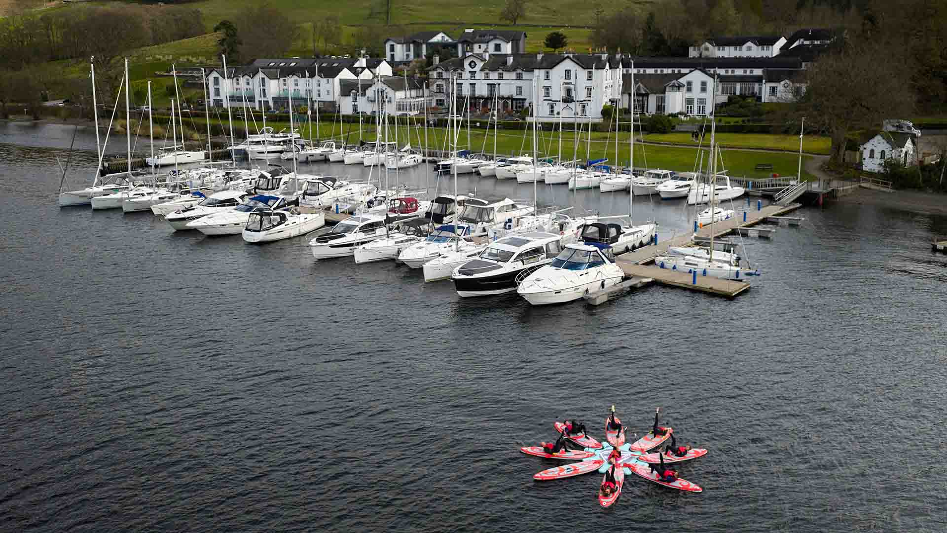 Group in the water in front of Low Wood Bay