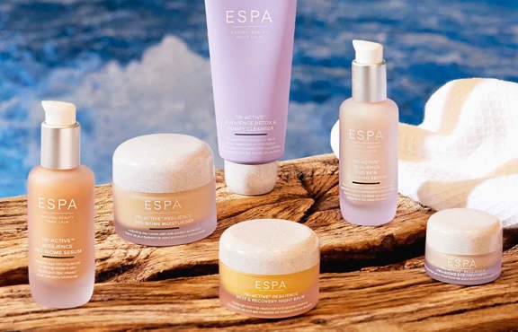 Range of Espa products balanced on a beam in the spa