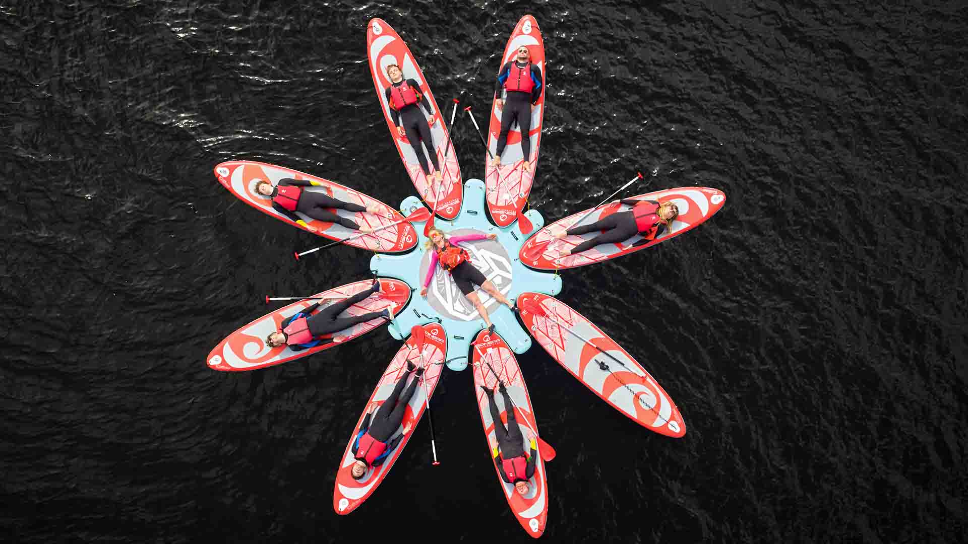Pilates session on boards from a drone above