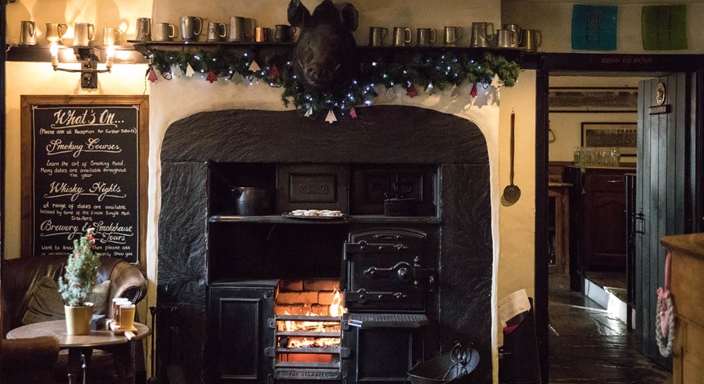 Christmas decorations above the entrance fireplace at The Wild Boar