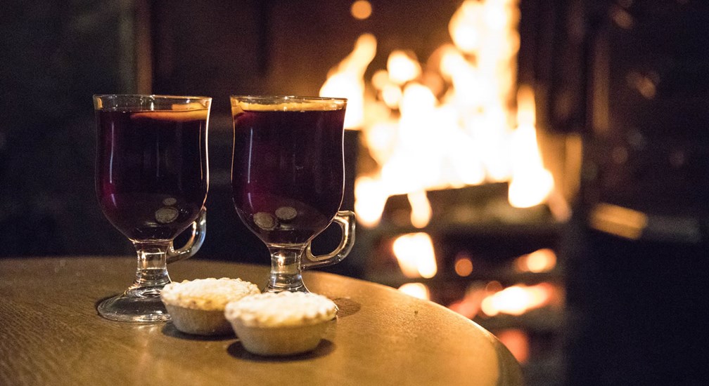Mulled wine and mince pies in front of The Wild Boar open fire