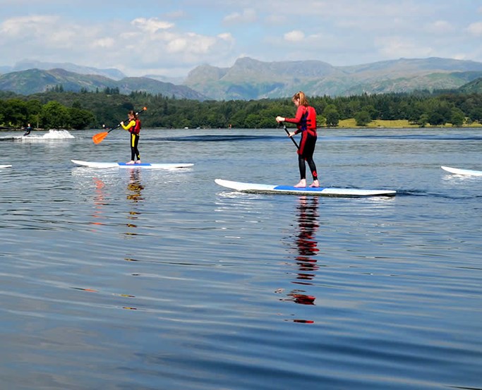 Family paddleboarding with The Watersports Centre at Low Wood Bay Resort & Spa