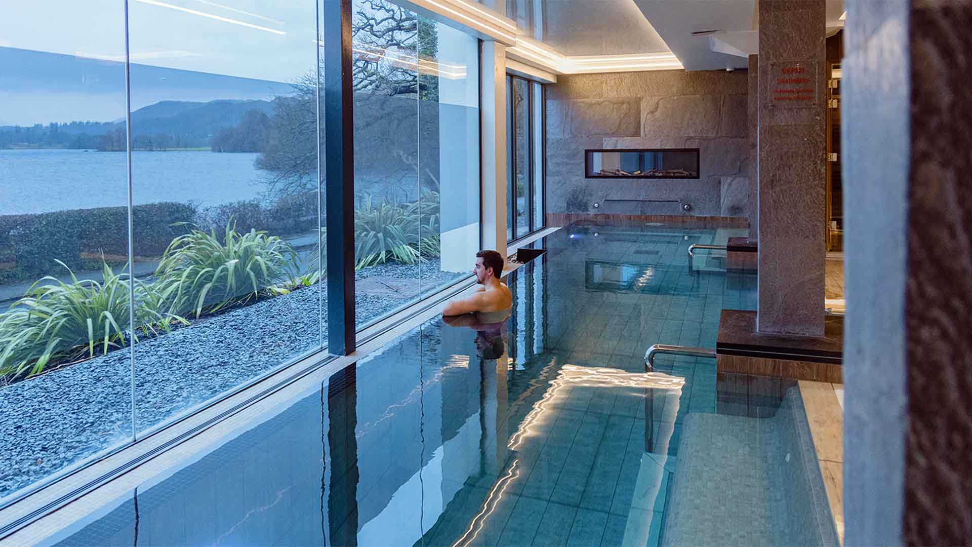 Young man in the indoor thermal pool at The Spa at Low Wood Bay