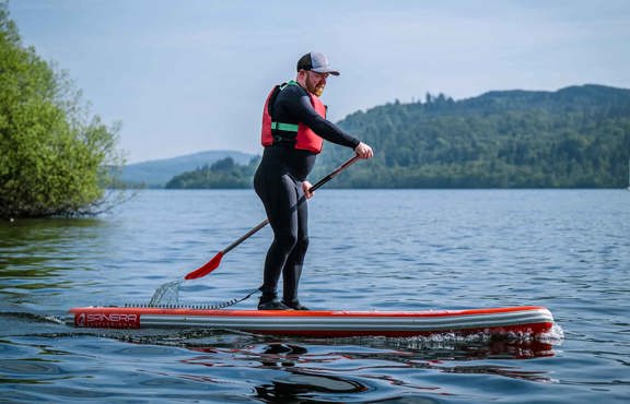 Man on paddleboard on lake windermere