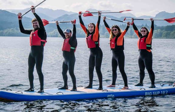 Group on the giant paddleboard on lake Windermere