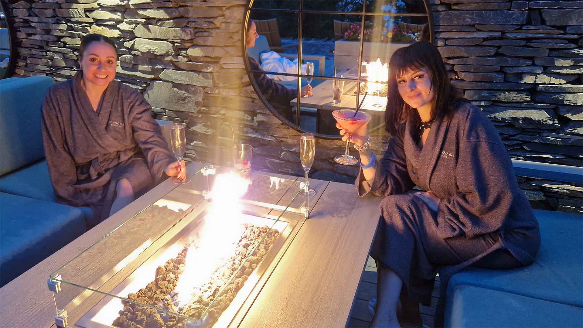 Couple sat by the outdoor vitality pool