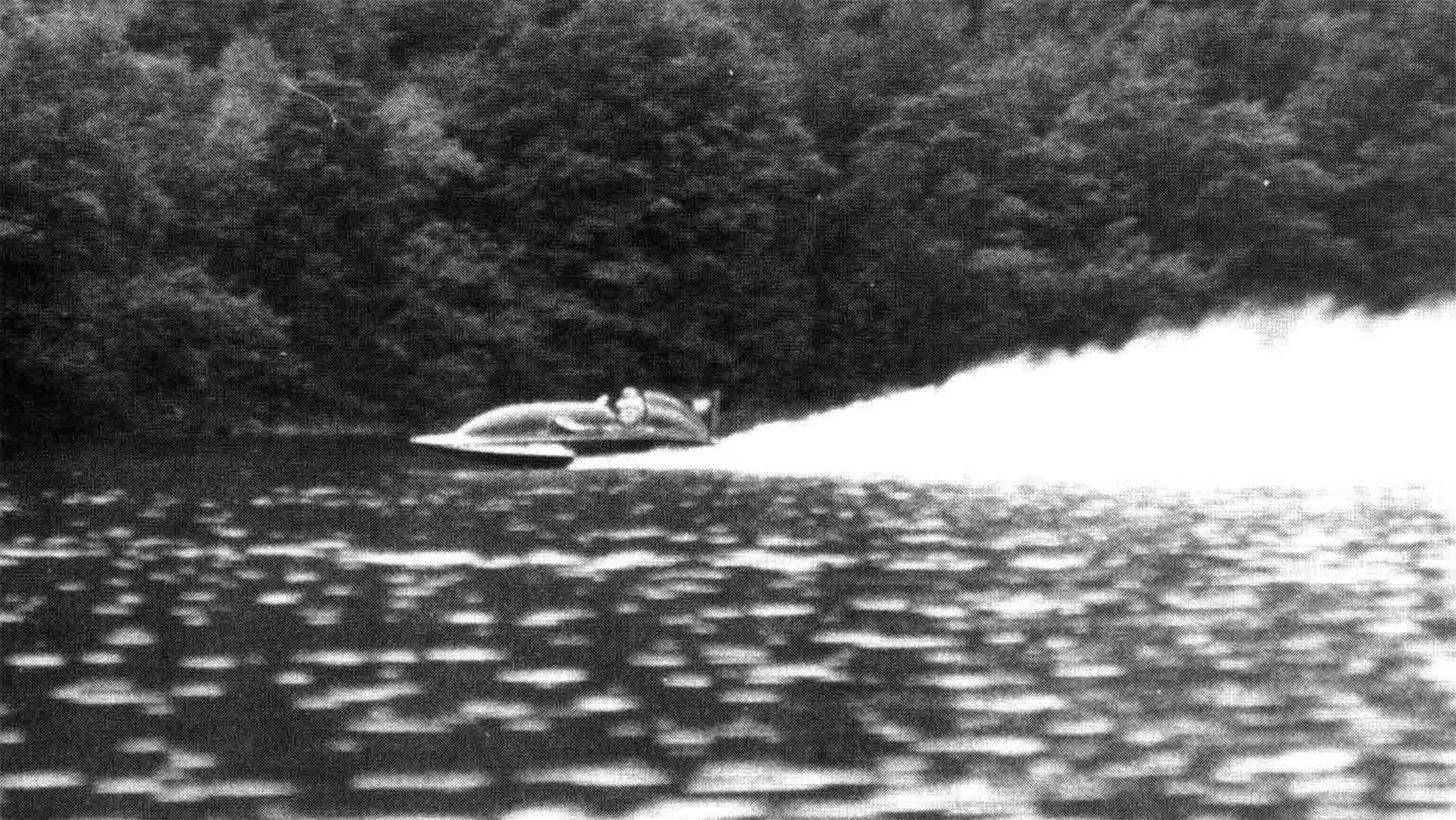 Norman Buckley in one of his boats powering along the lake