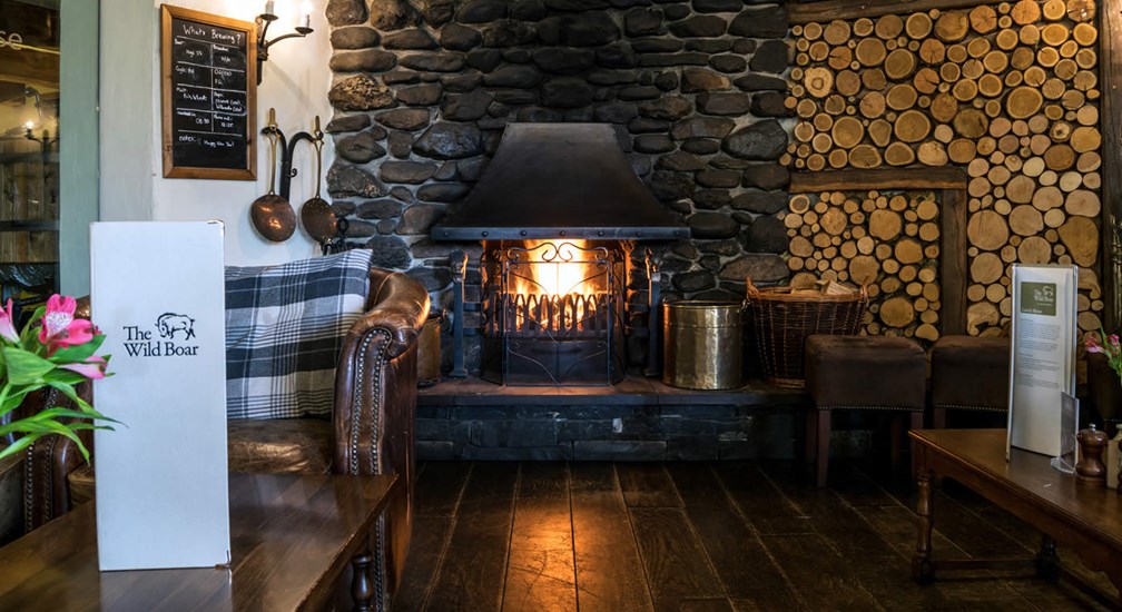 A traditional open fire in the lounge at The Wild Boar