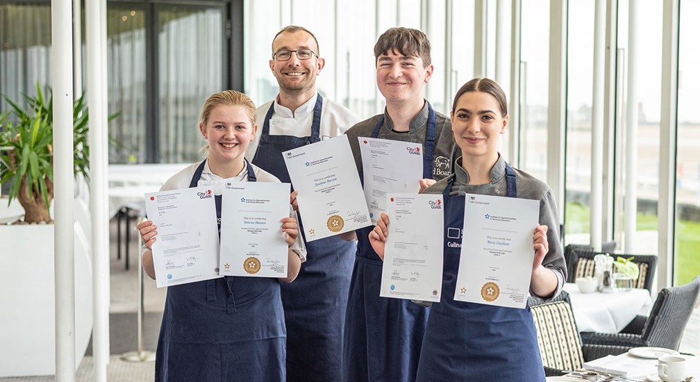 Daniel Winstanley and three of the Apprentice Chefs with their City & guilds Certificates