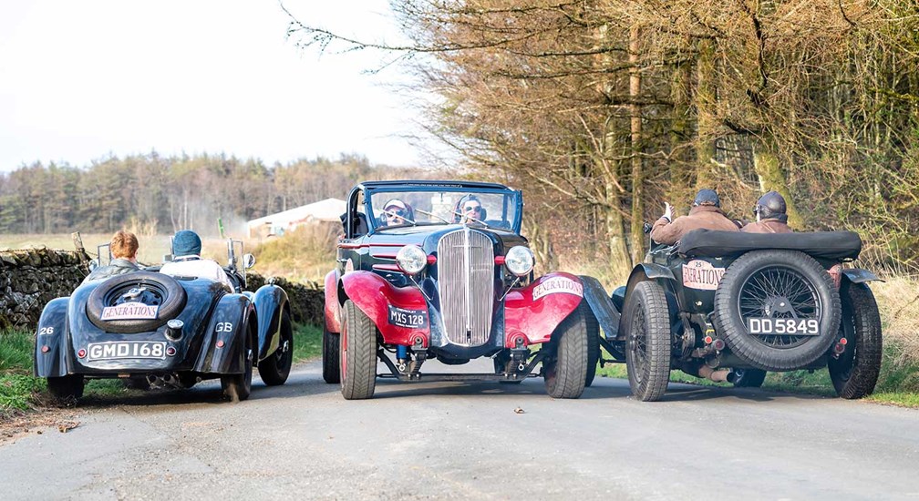 Trio of classic cars on a lakeland back lane.