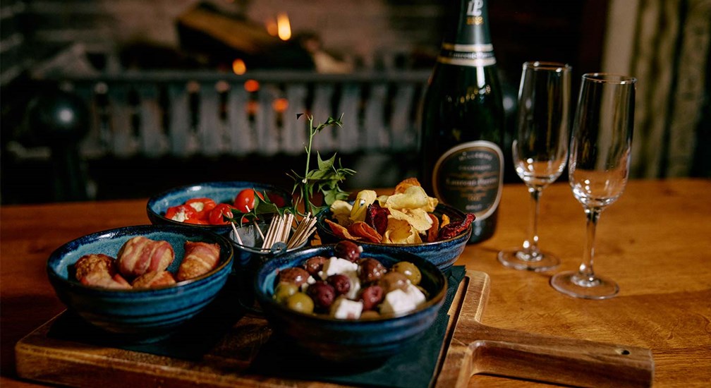 Selection of smaller plate dishes and Champagne by the fire