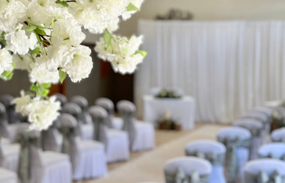 Flowers by the entrance to the ceremony