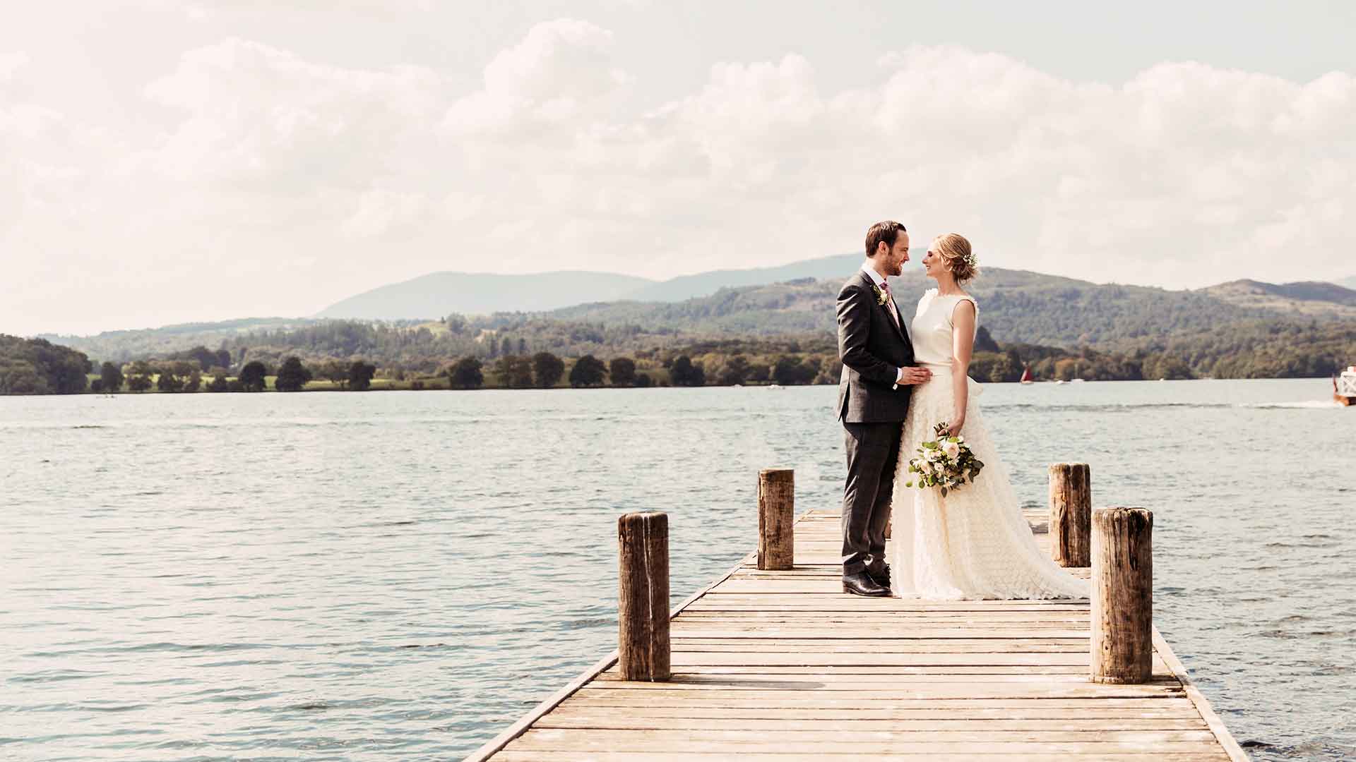 Couple stood on the Low Wood Bay Jetty