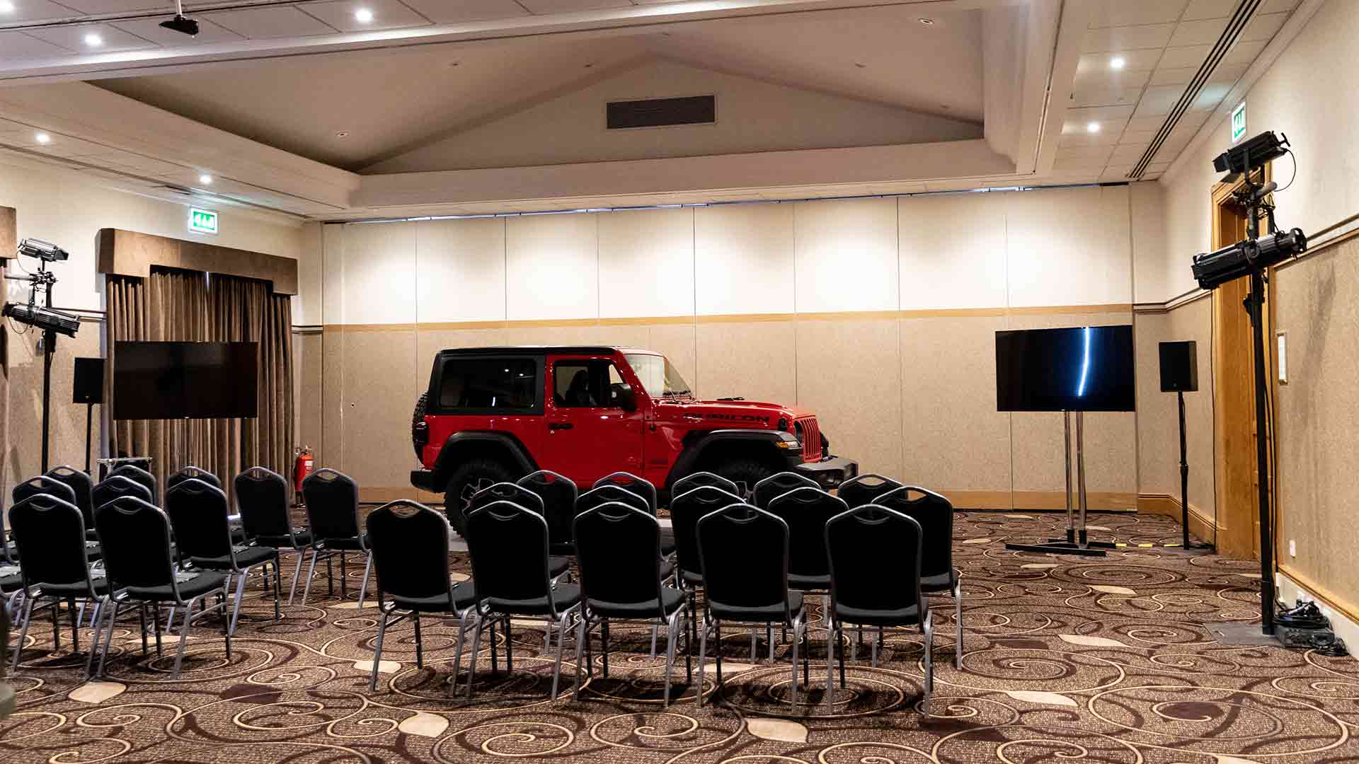 Jeep product launch at Low Wood Bay with a Jeep car in front of lines of chairs