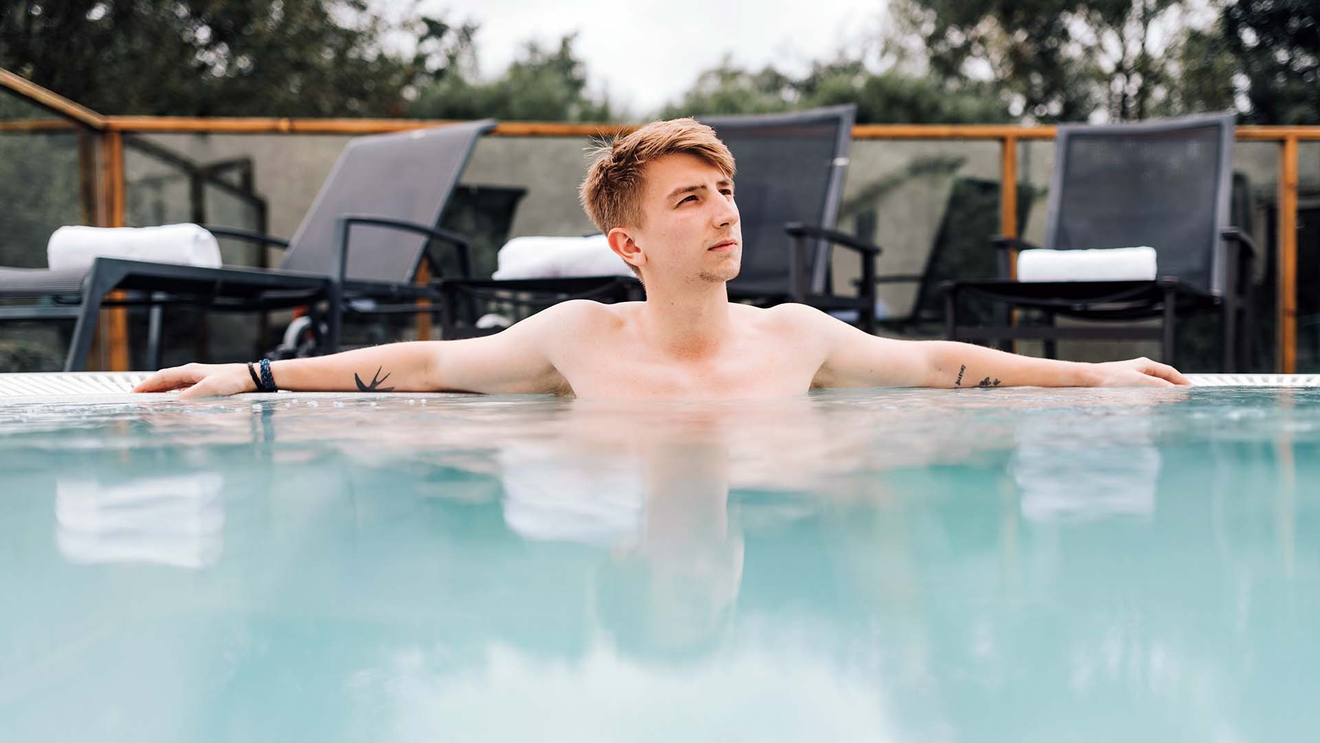 Young man relaxing in the Sandpiper Health Club's outdoor hot-tub at Lancaster House