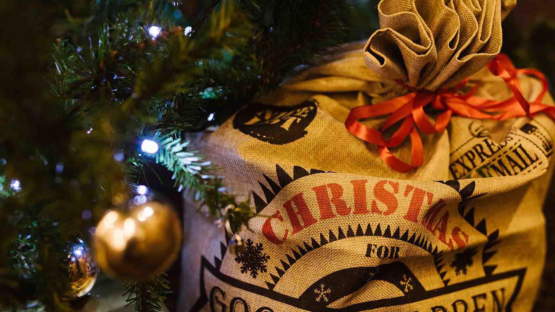 A sack of Christmas presents under the Christmas tree