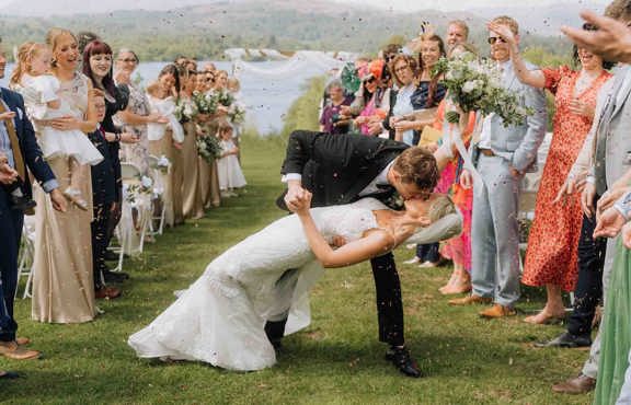 Wedding celebrations on the infinity pool above Low Wood Bay