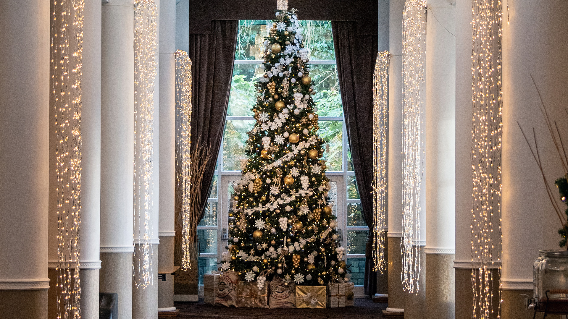 The gallery lounge at Low Wood Bay with a large Christmas tree at the end of the gallery