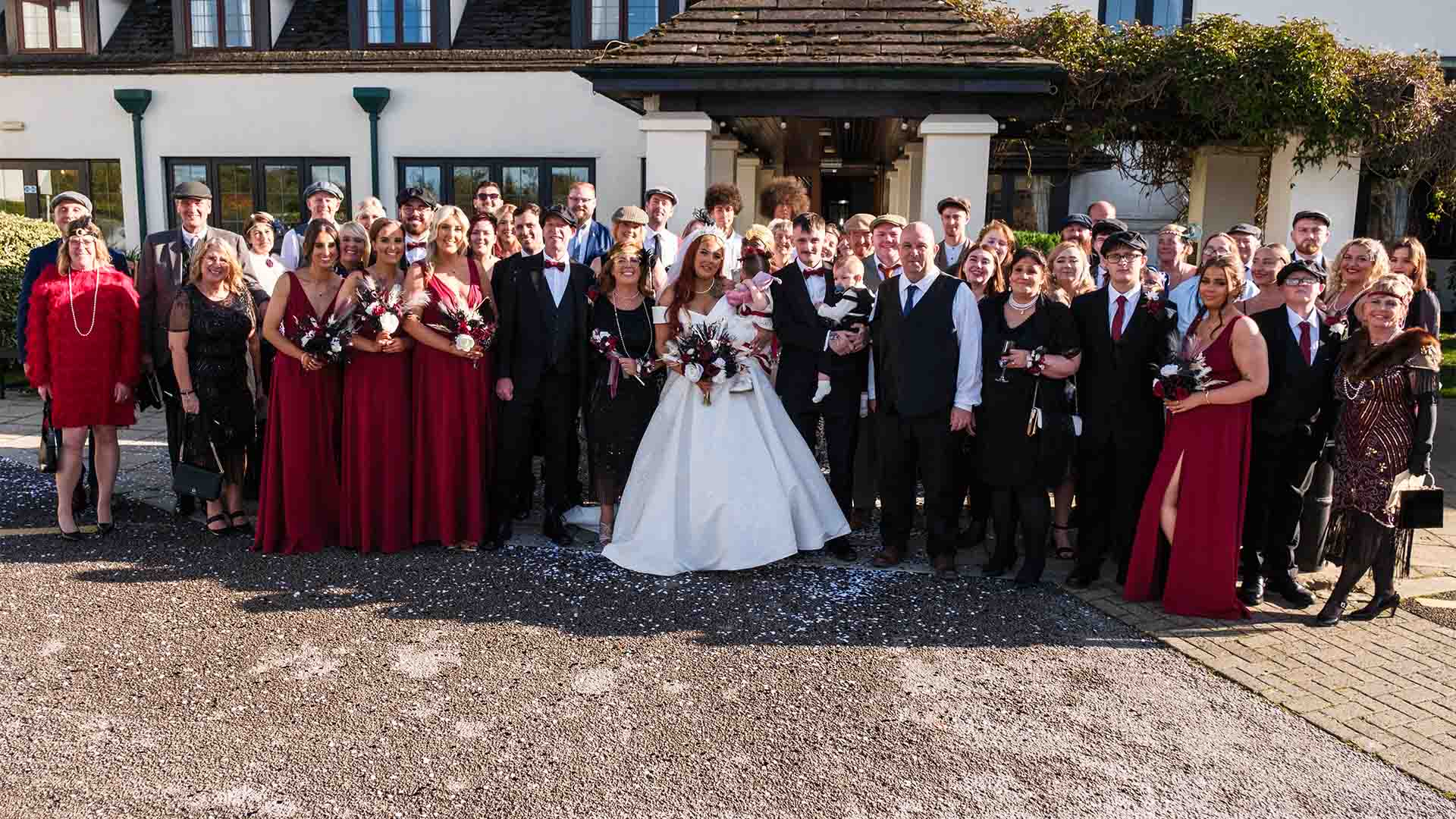 Wedding party by the entrance of Lancaster House Hotel