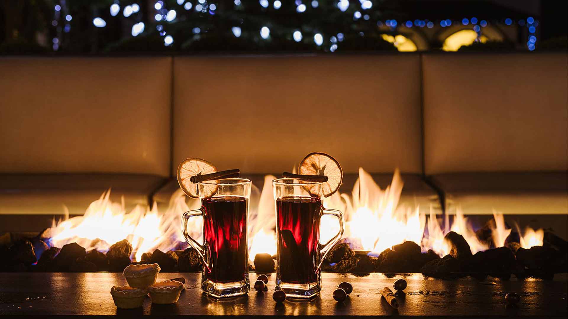 Two festive drinks by the outdoor firepit