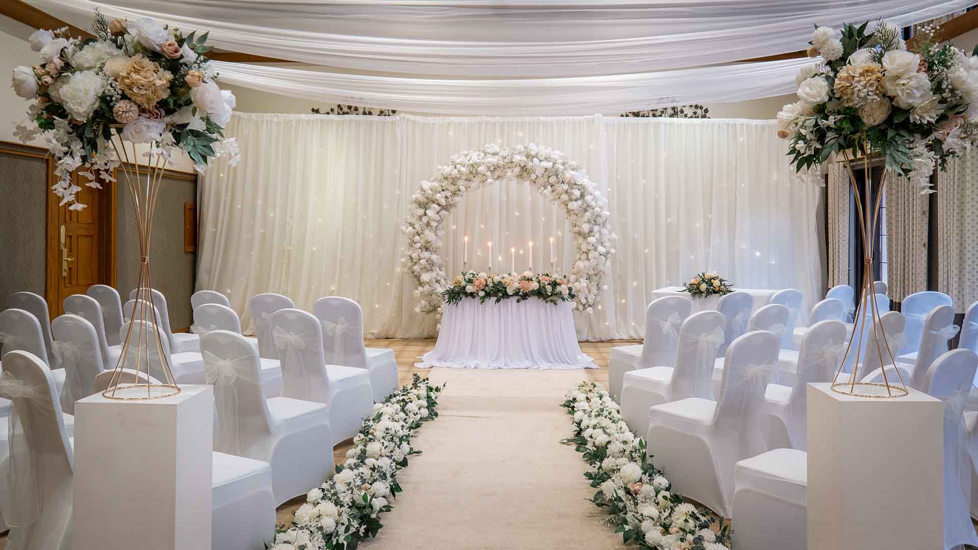 Wedding ceremony setup in the Dalton Suite at Lancaster House Hotel