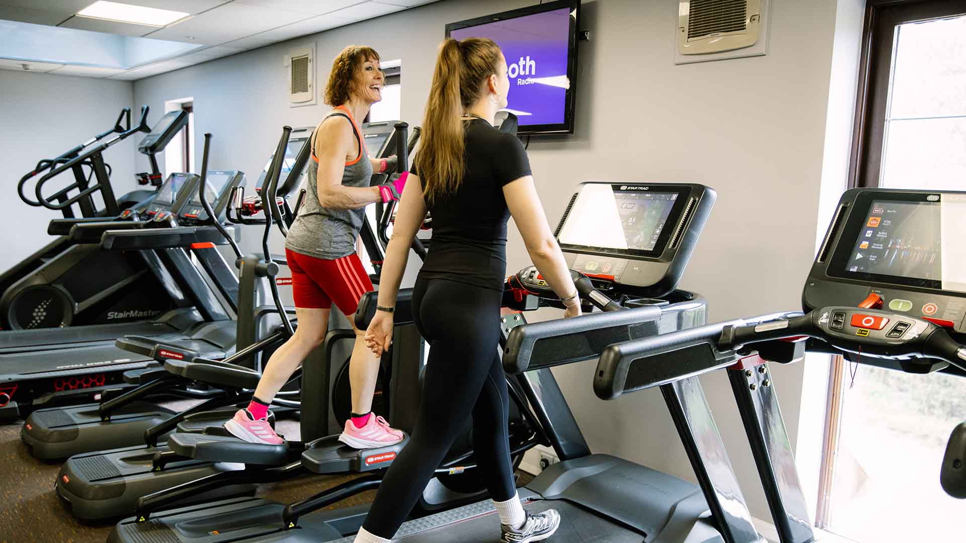 Two women on the tread machines