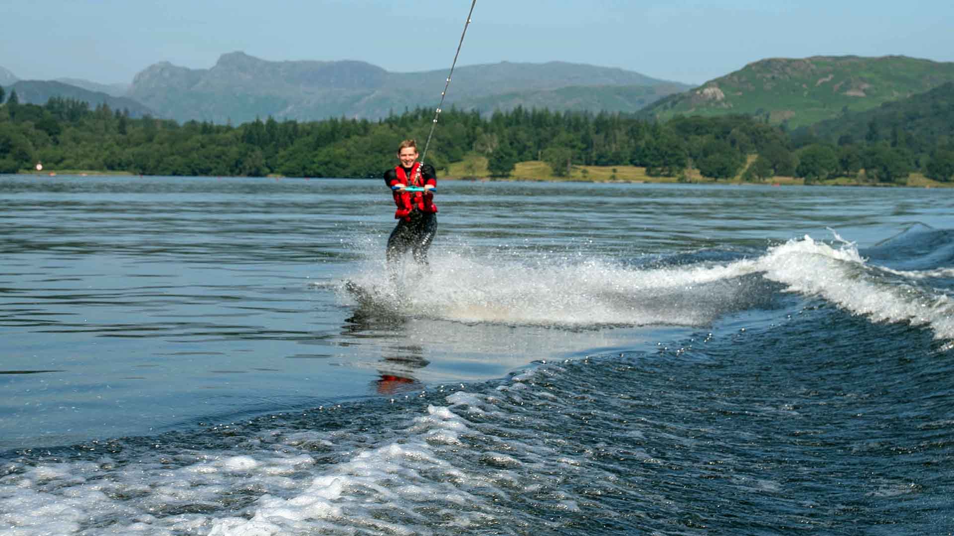 Waterskiier being pulled along on lake Windermere