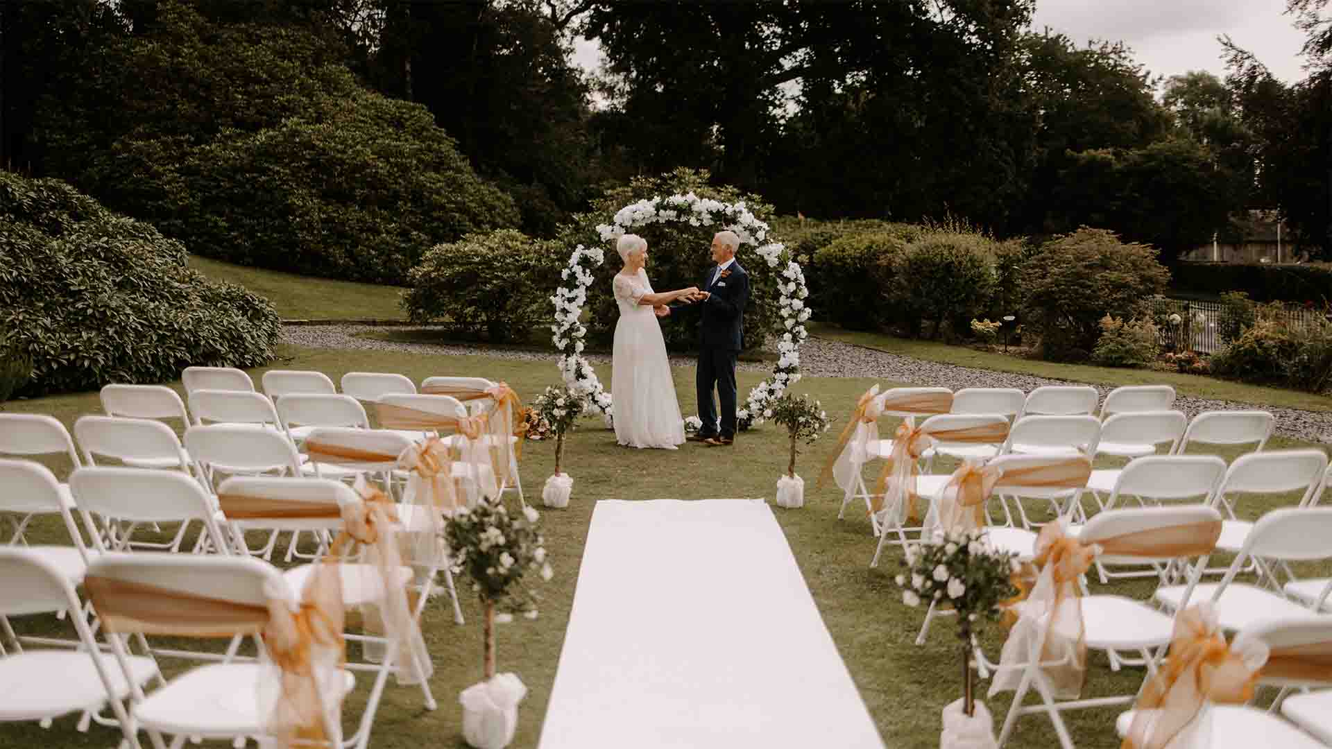 Outdoor wedding ceremony on the lawns of Low Wood Bay 