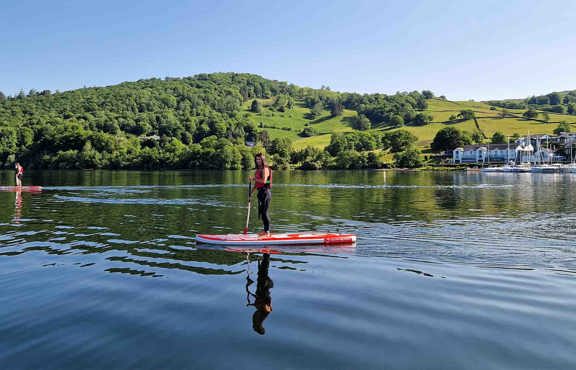 Young woman paddleboarding