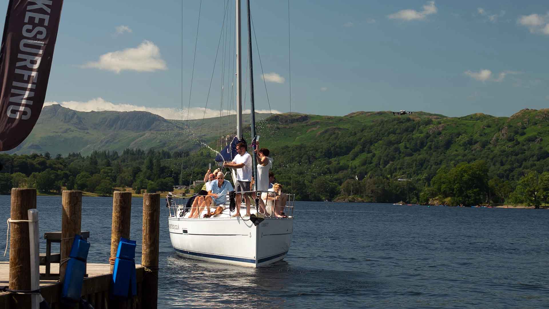 Group on a chartered yacht approaching the jetty