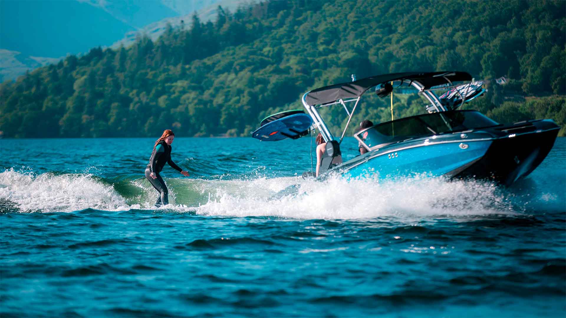 Young woman wakesurfing on lake Windermere