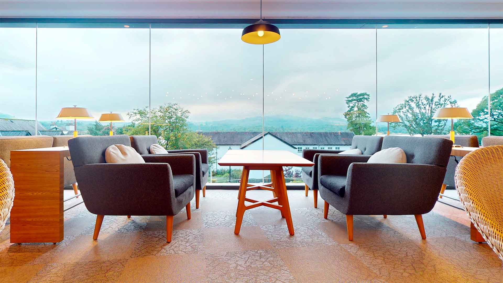 Relaxing seating in the breakfast lounge with dramatic views over Windermere