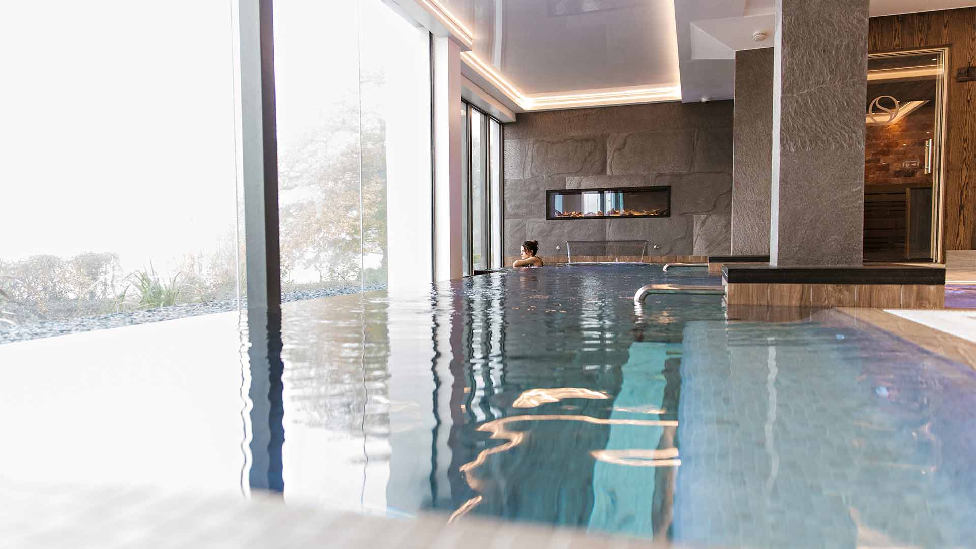 Young woman in the indoor thermal pool