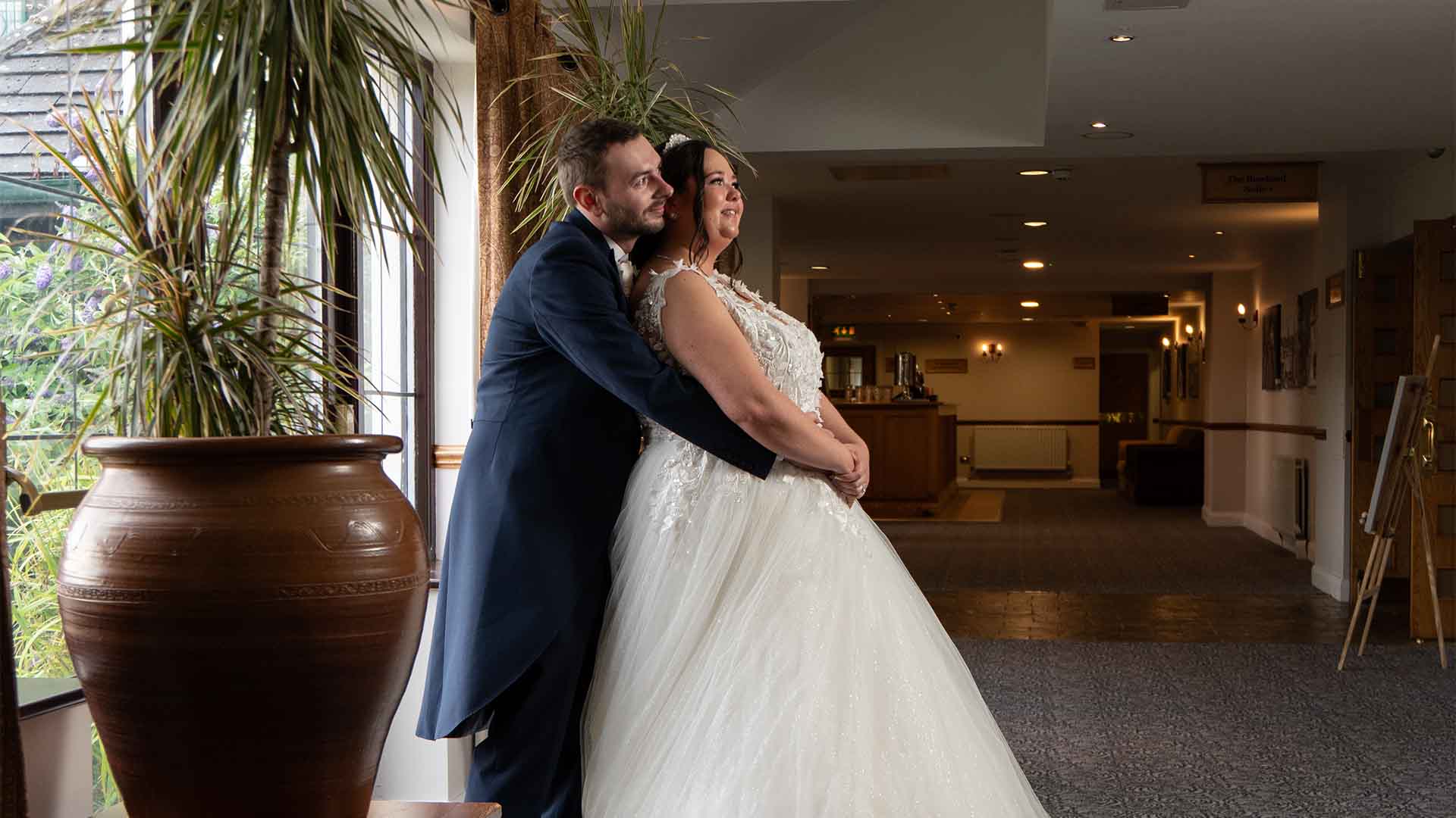 Couple stood for the camera in the hotel gallery