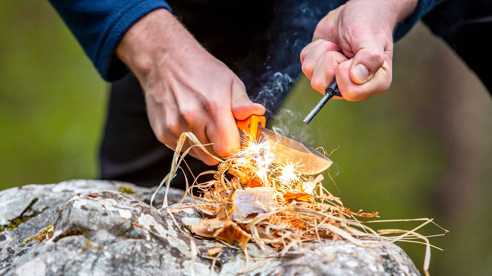 Lighting a fire with a flint