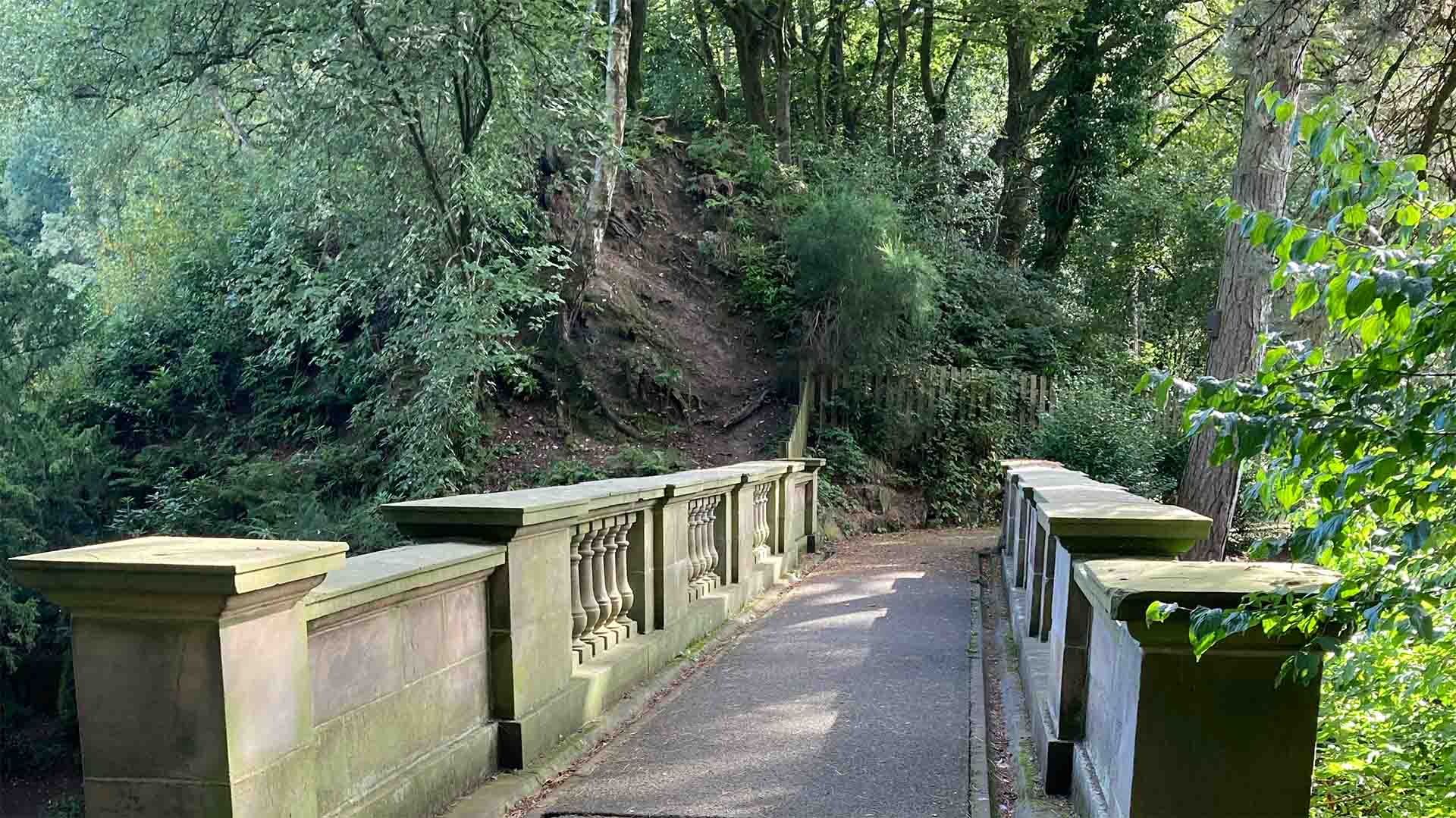 Bridge and woodland path through Williamson Park
