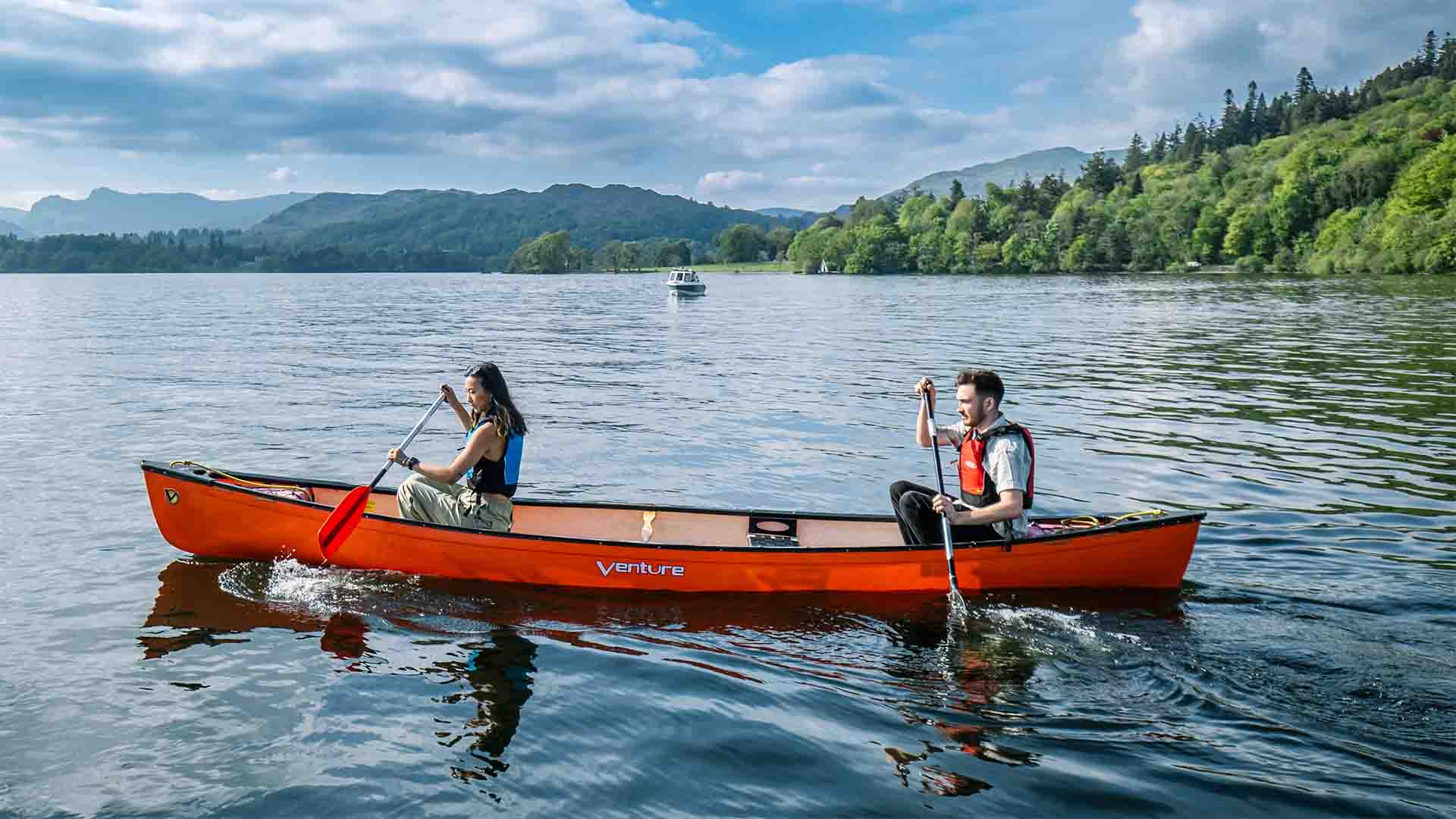 Couple in an open canoe on Lake Windermere