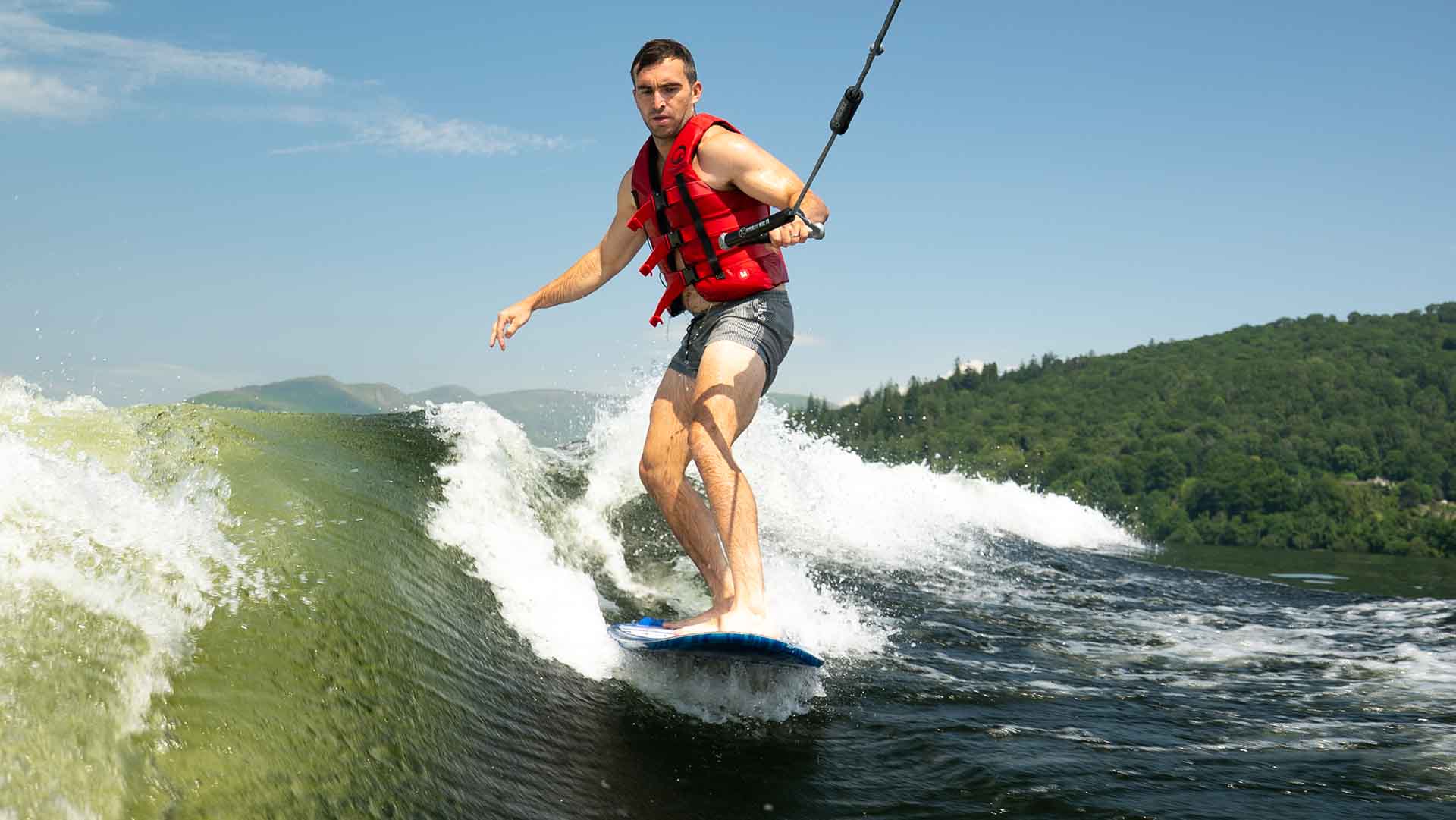 Youngman wake surfing on lake Windermere