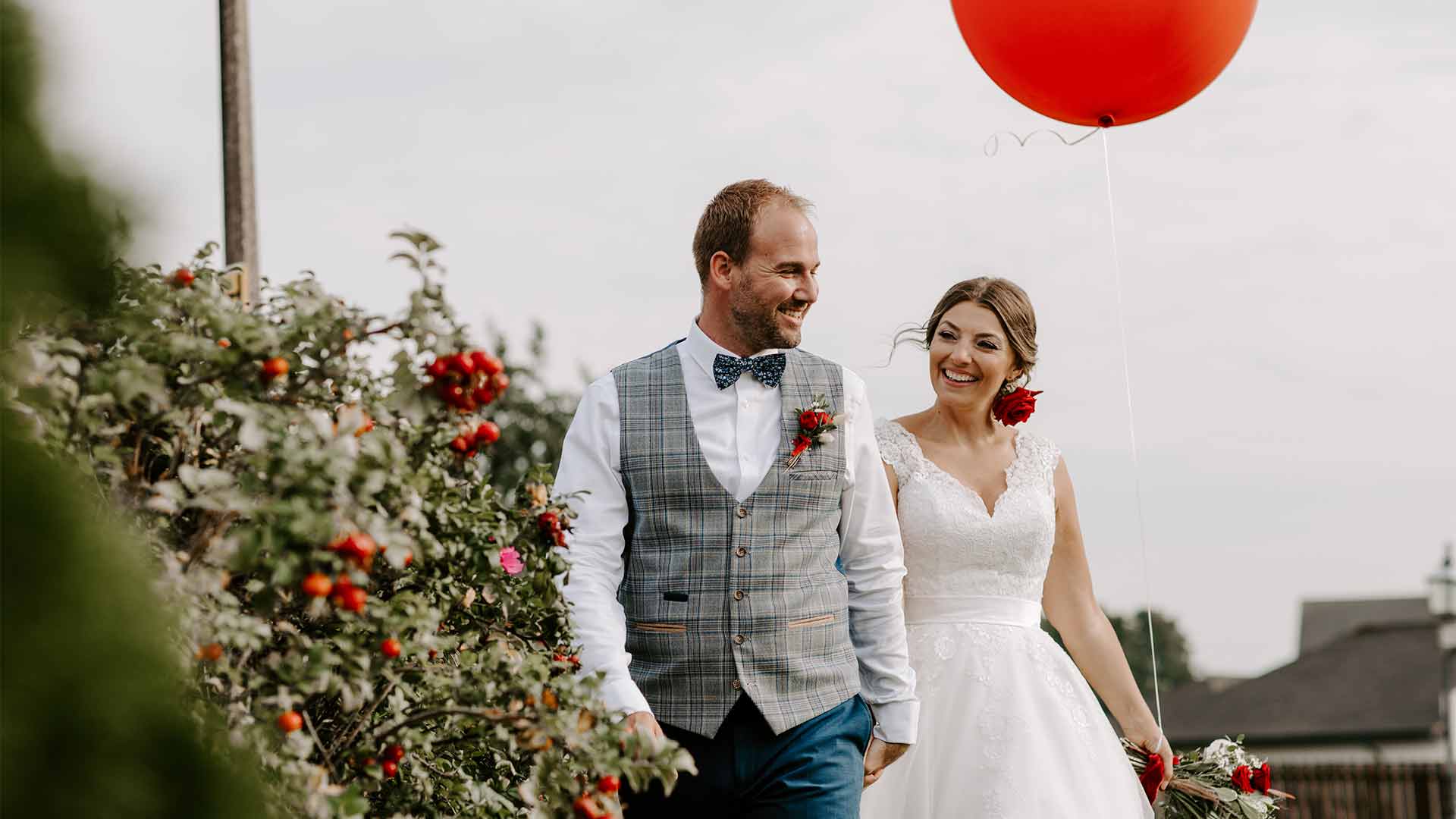 Bride and Groom walking through the hotel grounds