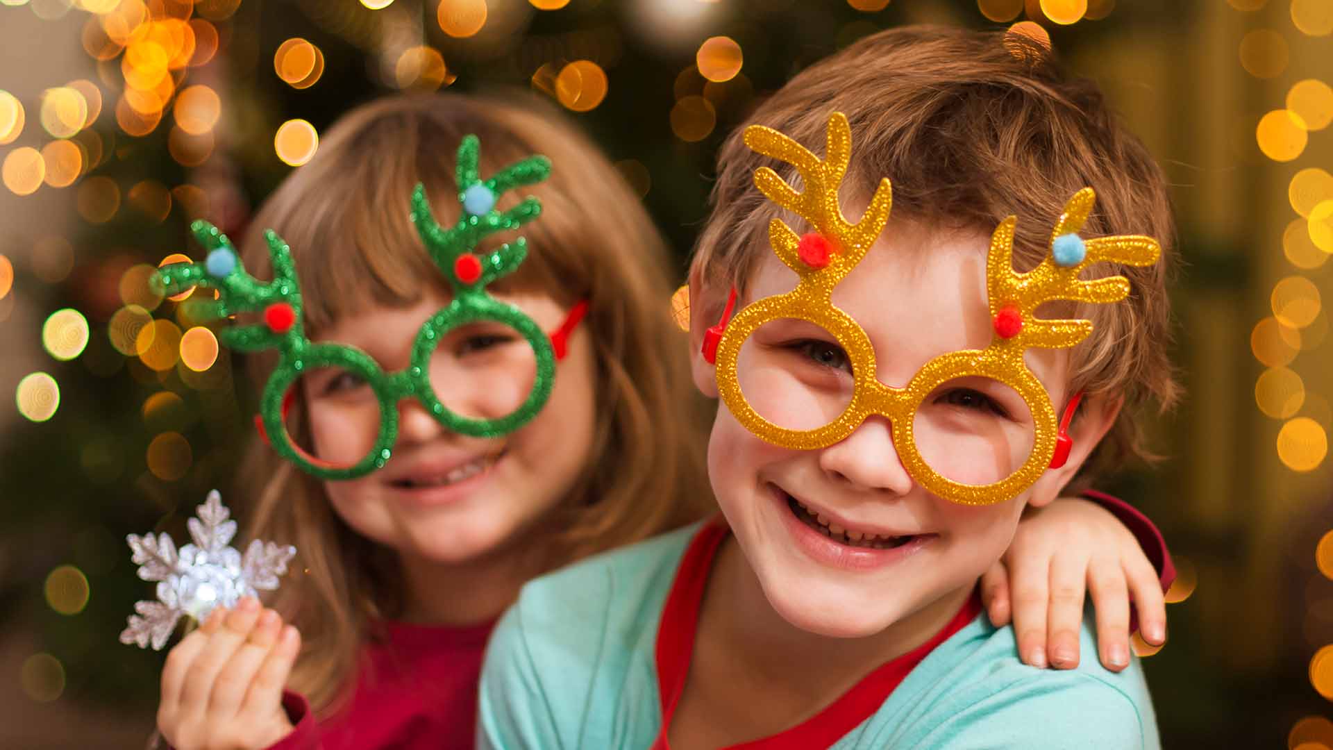 Children wearing festive comedy glasses
