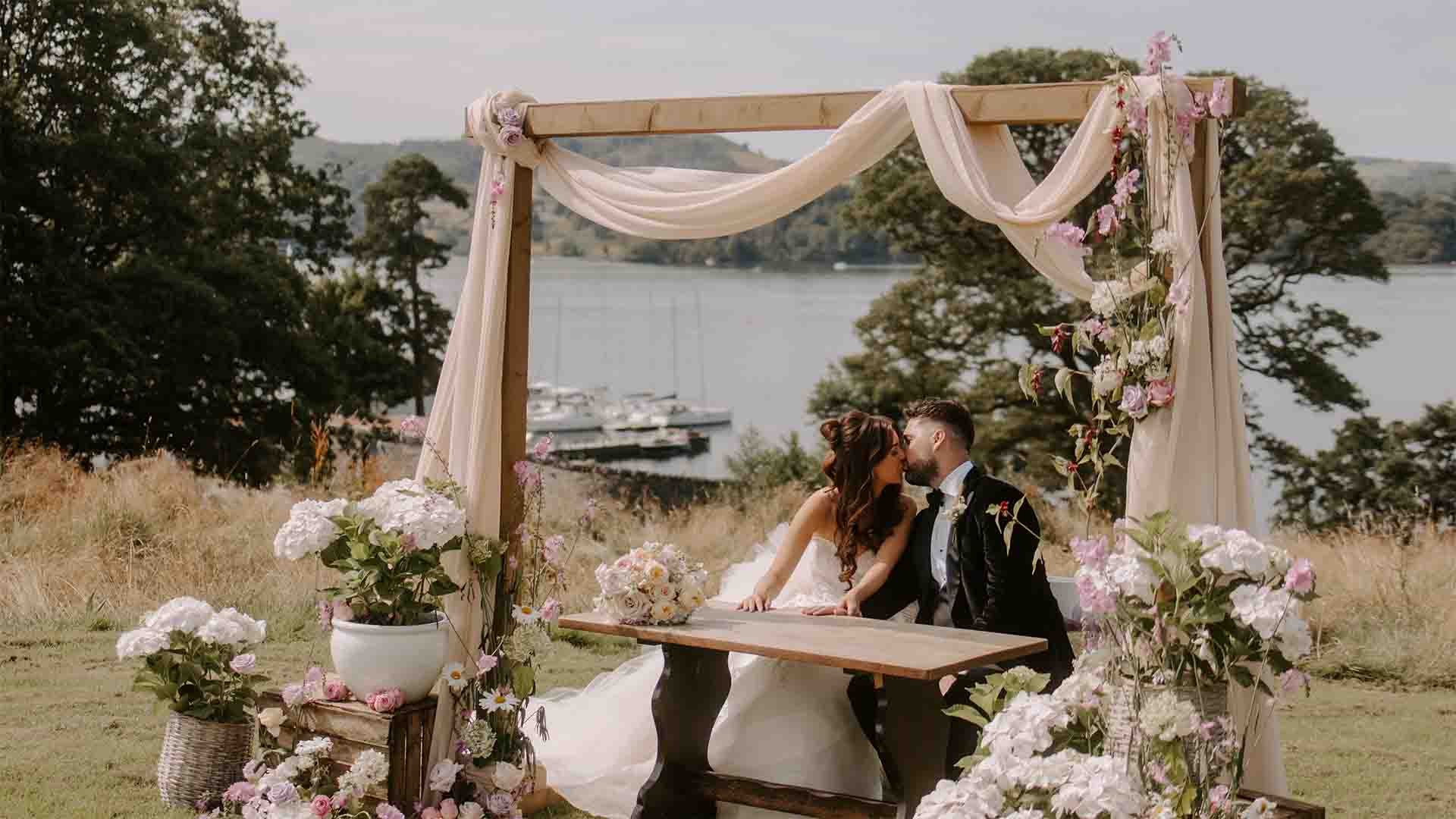 Wedding Ceremony on the Low Wood Bay infinity platform with Windermere in the background