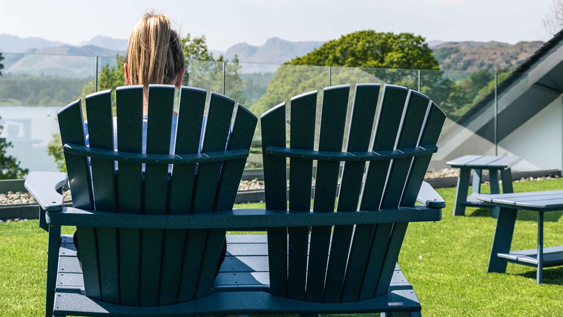 Young woman sat in one of the chairs on the roof terrace