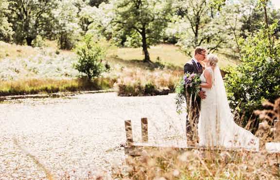 Lucy and LLoyd on the jetty by the tarn in the Wild Boar woods