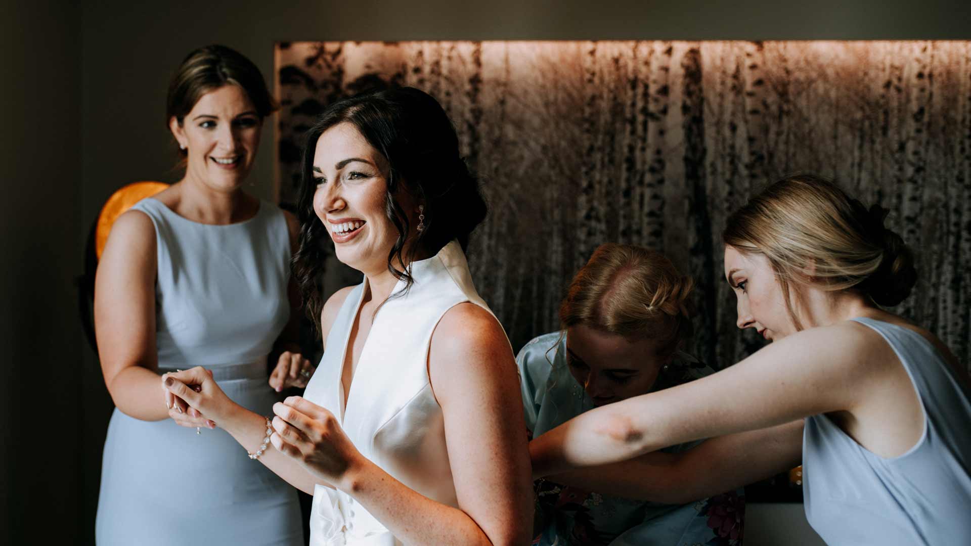 Bride and brides maids getting ready in one of the Winander Rooms