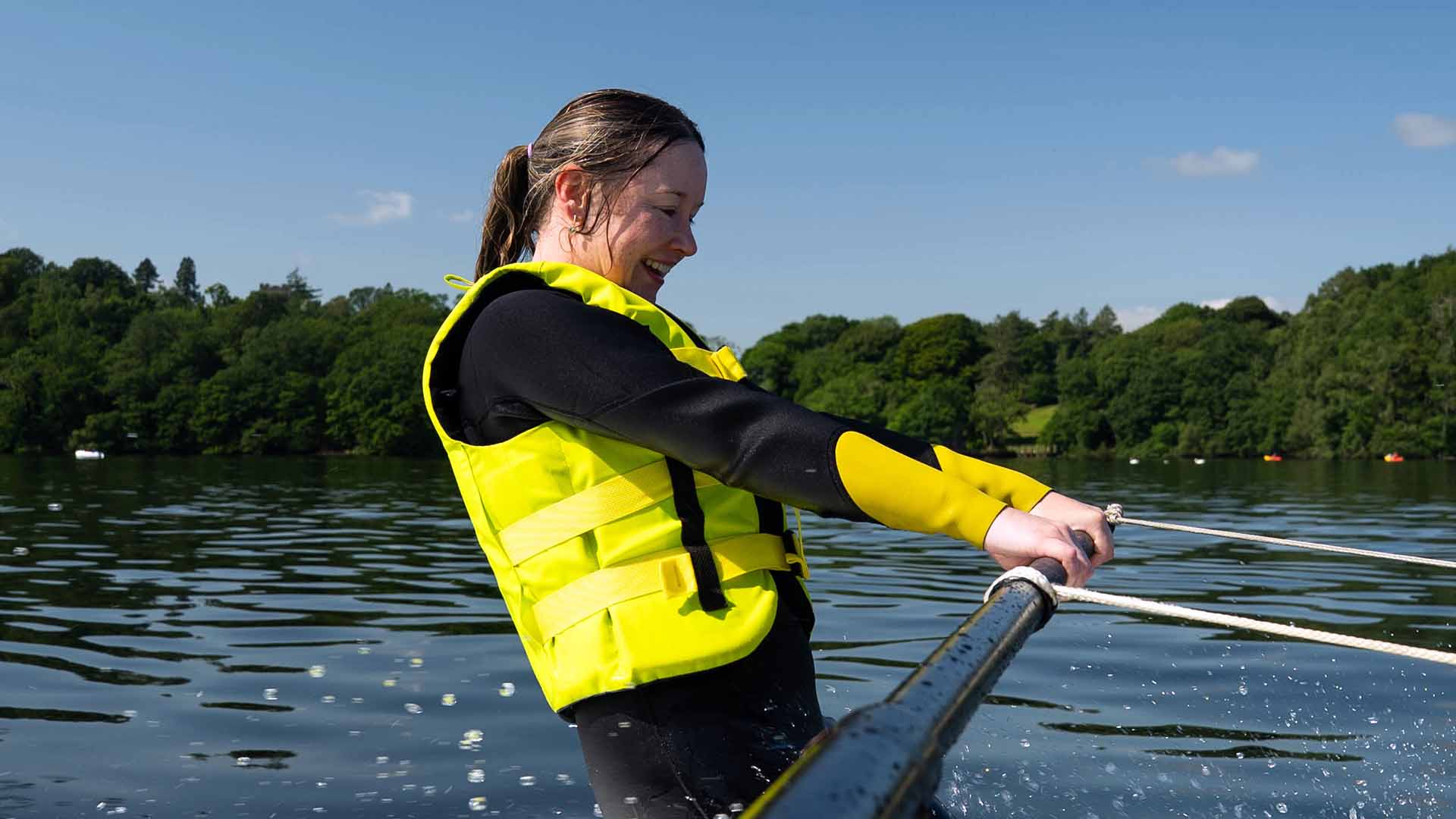 Young woman learning to water-ski on Lake Windermere