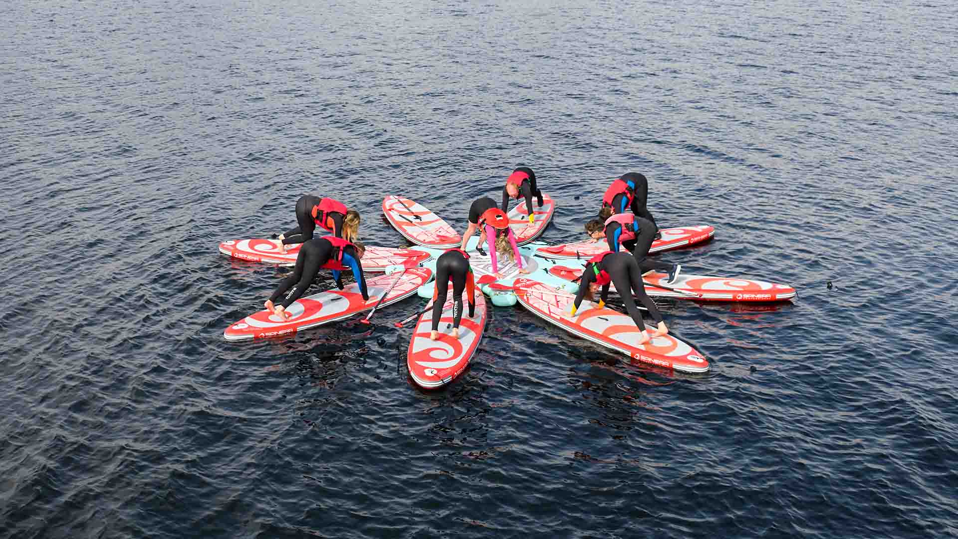 Stretch and paddle session in the waters of lake Windermere