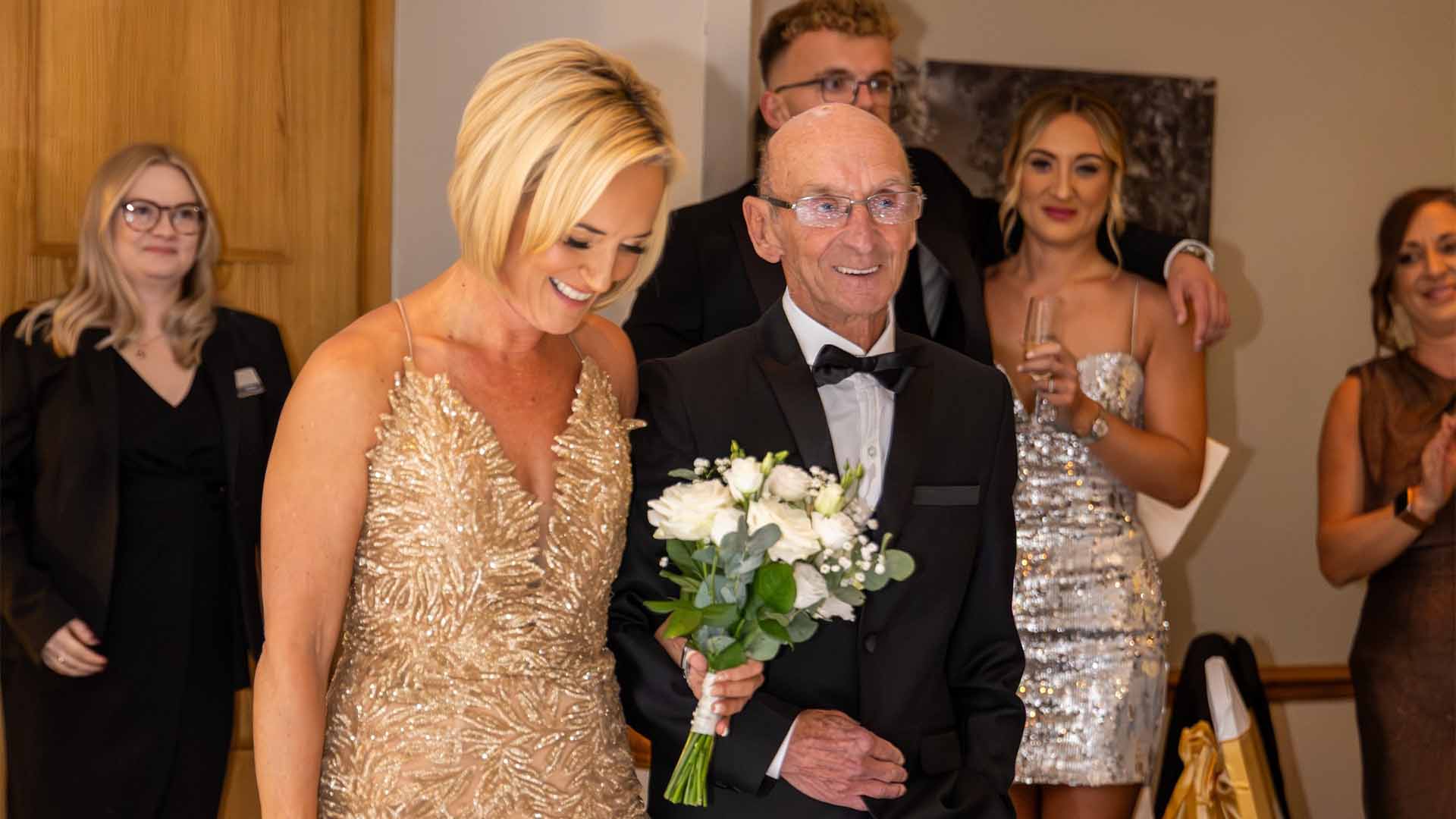 Natalie and father walk down the aisle