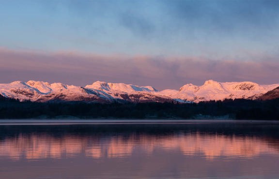 sunrise on langdale from low wood bay